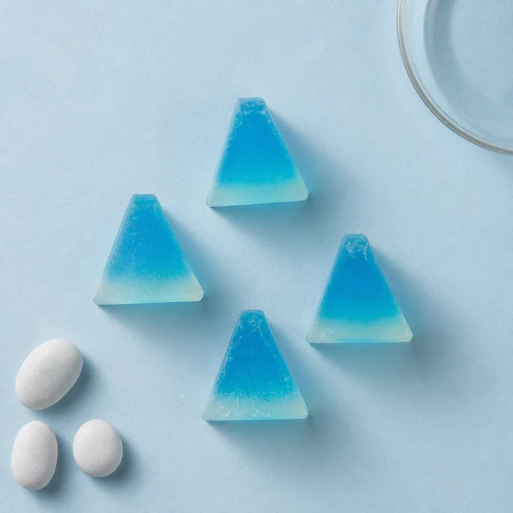 Blue Fujisan Kohakutou sugar crystals on a Mount Fuji-inspired background