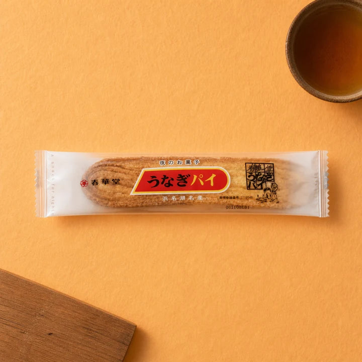 Unagi Pie package on a refined warm yellow background